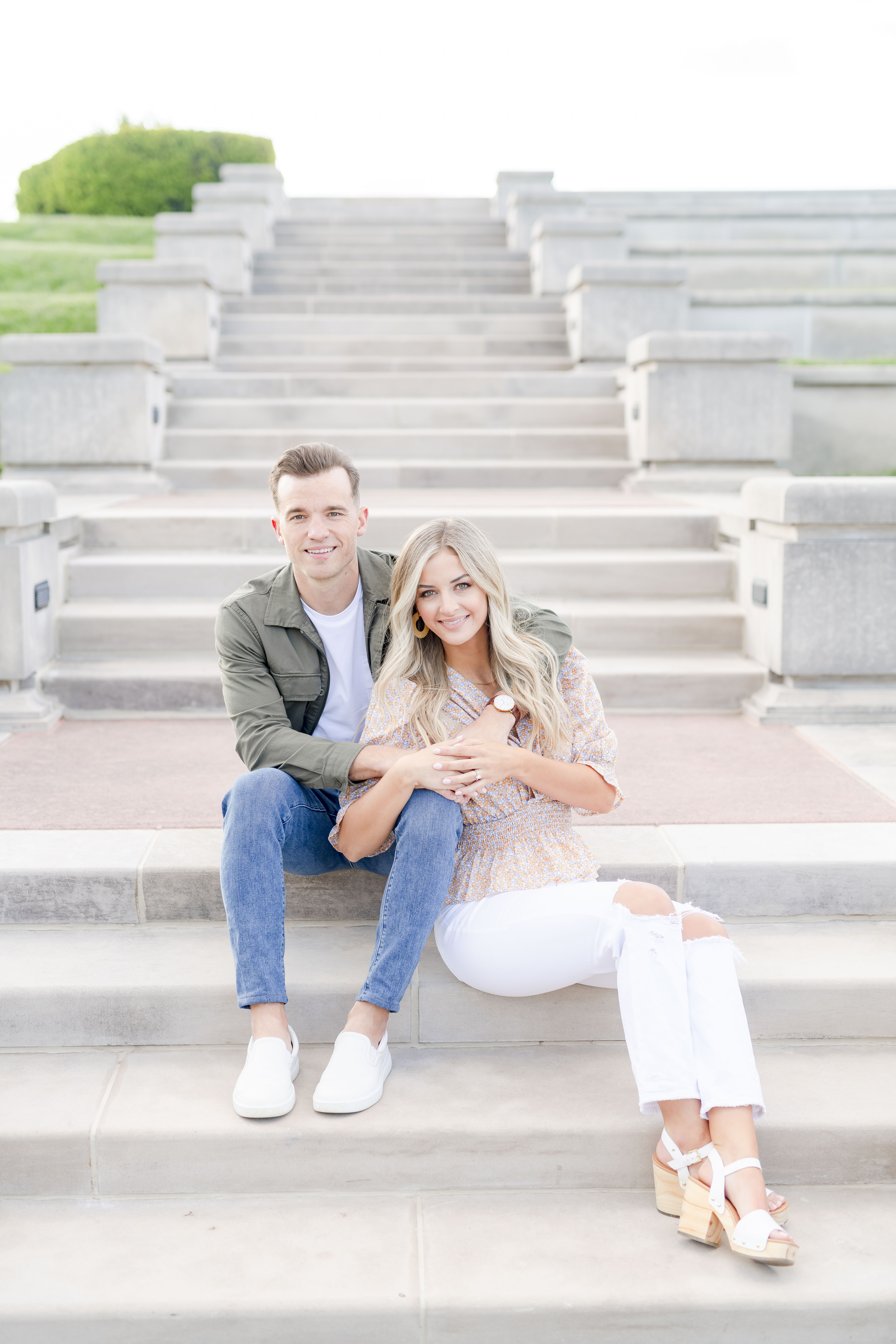 Couple posing for engagement portraits at Coxhall Gardens in Carmel, Indiana