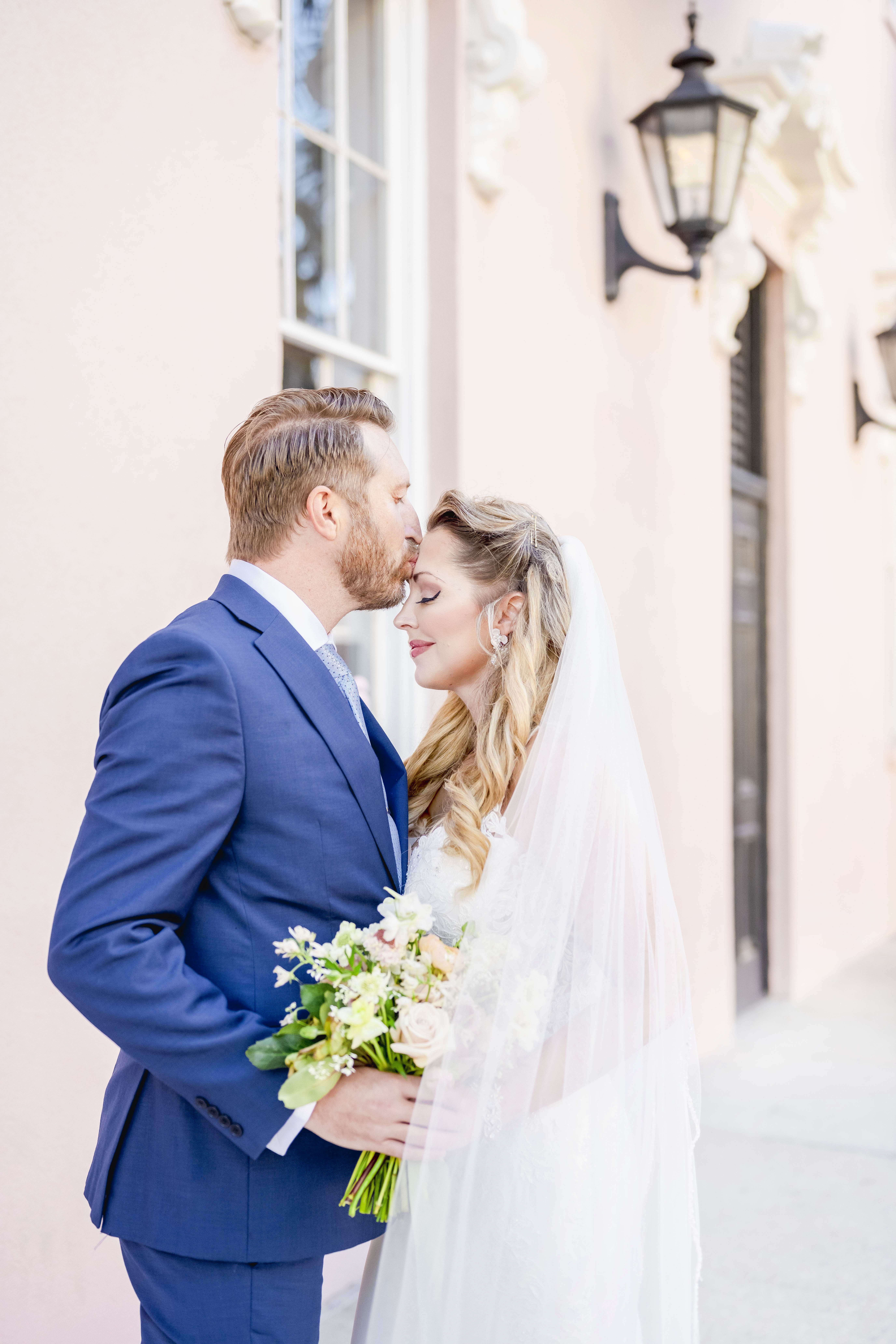 Couple standing in front of the Mills House Hotel on Wedding Day in Charleston South Carolina